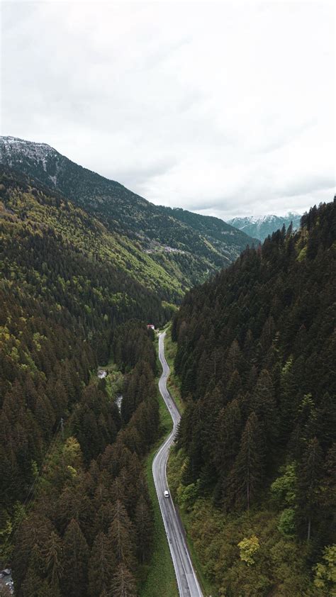 Download Wallpaper 1350x2400 Road Mountains Aerial View Forest
