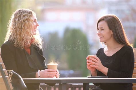 Happy Businesswomen Talking Together During Coffee Break Meeting At