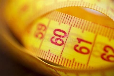 Various Tape Measure As Background A Yellow Measuring Tape As