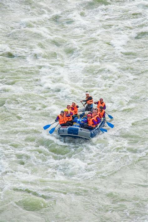 Learn more & schedule your appointment! One Raft With A Group Of Tourists Rafting On The Mountain ...
