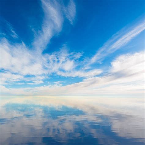 Blue Sky With Majestic Clouds Reflection In Water Stock Image Image