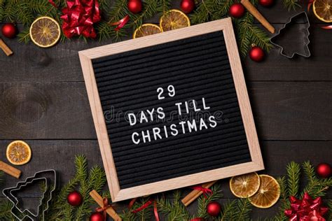 26 Days Till Christmas Countdown Letter Board On Dark Rustic Wood Stock