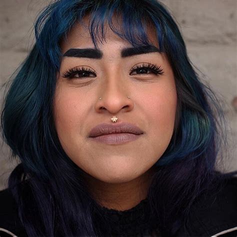 Tattooing sperrys on a boat. Fresh philtrum piercing with a solid gold bee done by ...