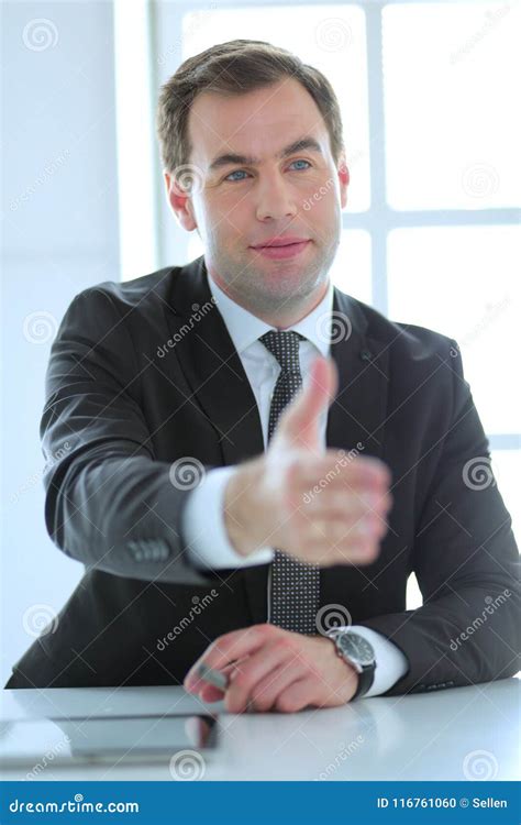 Portrait Of Businessman Giving Hand For Handshake Stock Photo Image