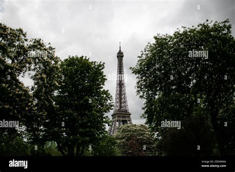 View Of Eiffel Tower Through Trees In Paris Stock Photo Alamy