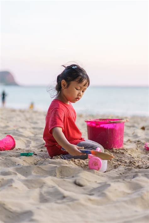Child Playing Sand Beach On The Beach On Summer Holidays Children