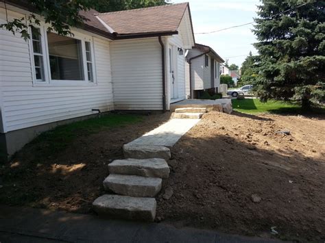 Armour Stone Retaining Wall And Steps With Pre Cast Patio Glencoe