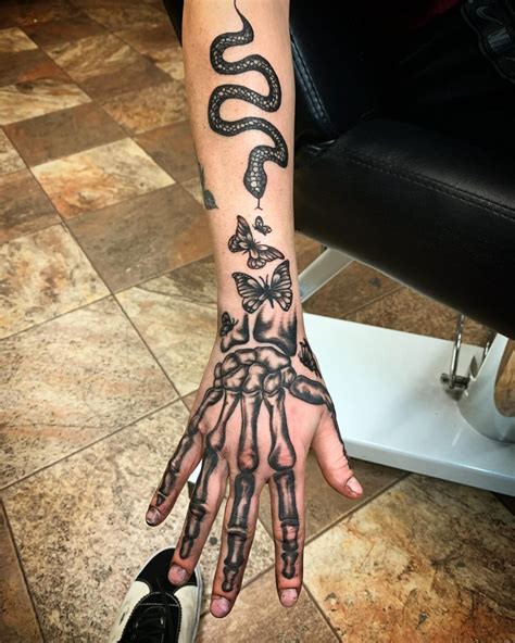 22 Amazing Skeleton Hand Tattoos That Are Scary And Attractive