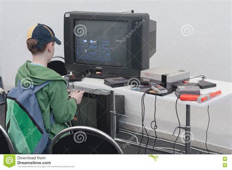 Boy Plays Gaming Console With Television At Animefest Editorial Photo