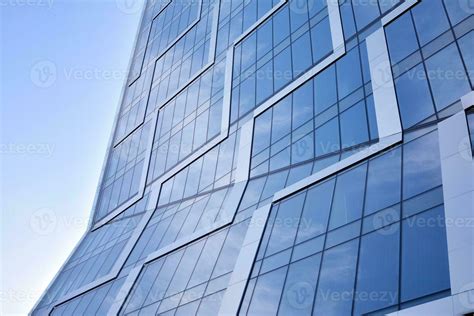 Glass Building With Transparent Facade Of The Building And Blue Sky
