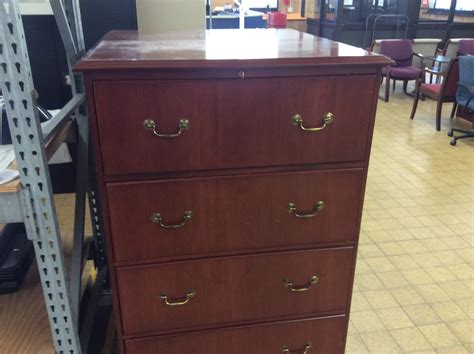 Storage file cabinet with casters in cherry finish. 19x36x53" Cherry wood 4 drawer file cabinet (2/25/2020 ...