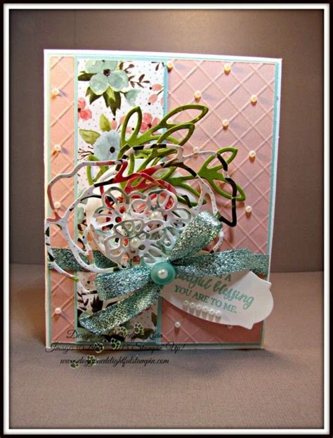 A Close Up Of A Greeting Card With Flowers And Ribbons On The Front