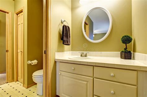 See more ideas about yellow bathrooms, beautiful bathrooms, bathroom design. Bathroom Interior In Yellow Tones With Vanity Cabinet ...
