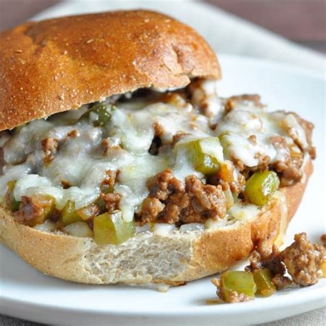 I know there is plenty of debate out there surrounding what truly belongs in a philly cheesesteak, but our sloppy joe version starts with green peppers and onions that are sauteed in butter until they're soft and fragrant. Philly Cheese Steak Sloppy Joes #lunchideas #sandwich