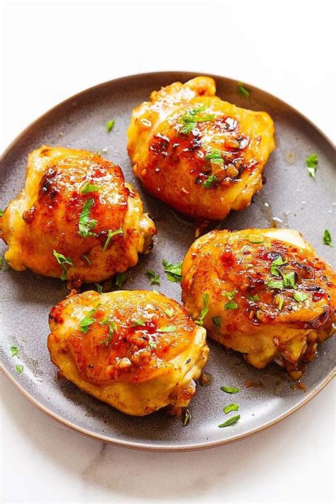 The fresh herbs and sweet apricots will help to offset some of the intensity of the harissa. Baked chicken thighs in a serving platter. in 2020 | Baked chicken thighs, Baked chicken ...