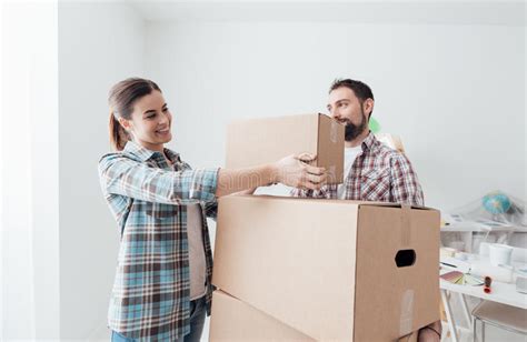 Young Couple Moving Into A New House Stock Photo Image Of Apartment