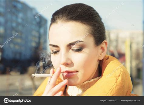 Young Woman Smoking Cigarette — Stock Photo © Belchonock