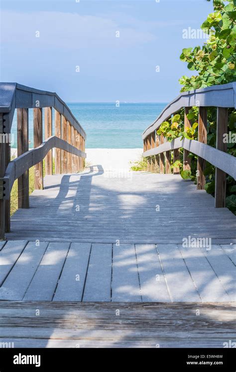 Wooden Boardwalk To The Ocean On Sunset Beach Treasure Island Florida