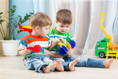 Two Little Boys Play Together With Educational Toys Stock Image Image