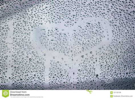 Heart And Raindrops Drawn Romantic Blurred Love Symbol Drawn By Hand On The Wet Window Glass