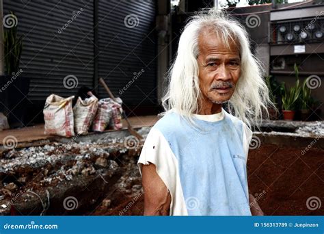 An Adult Filipino Man With Long Gray Hair Pose For The Camera Editorial Stock Image Image Of