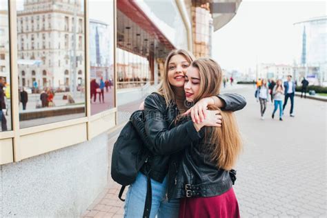Happy Meeting Of Two Friends Hugging In The Street Stock Image Image