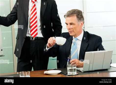 Senior Manager Or Boss In Meeting Drinking Coffee Stock Photo Alamy