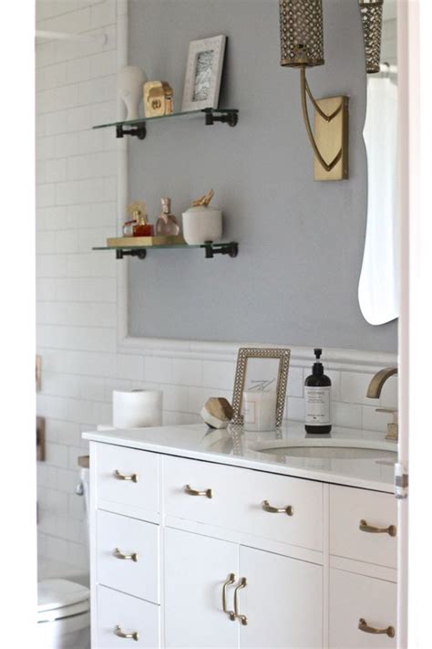 A vanity for the whole family. White Subway Tile Bathroom With Brass Fixtures
