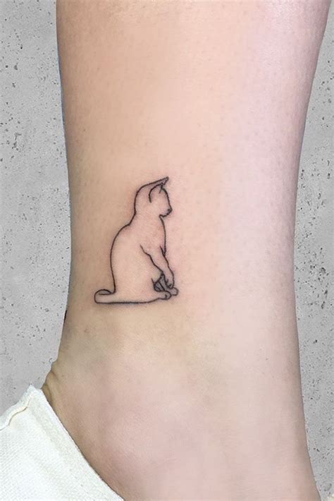 a cat tattoos guide to help you choose the best tattoo design minimalist cat tattoo cat