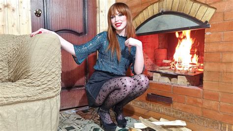 a red haired beautiful girl in black pantyhose and a short skirt kindles a fireplace youtube