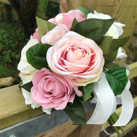 A Wedding Bouquet Of Artificial Silk Vintage Pink And Ivory Roses