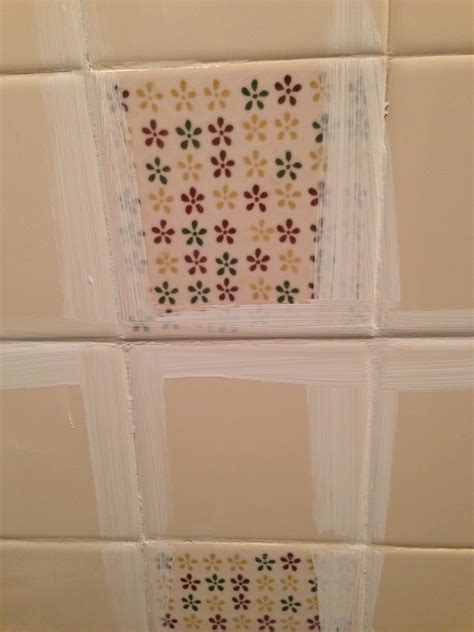 Tired of that ugly ceramic tile?! Remodelaholic | A $170 Bathroom Makeover with Painted Tile