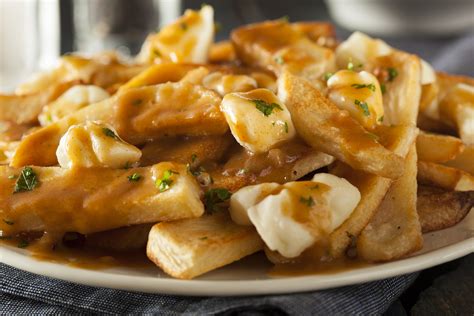 Poutine Topped With Cheese Curds Delicious Food And Wine