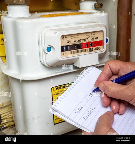 Taking A Domestic Gas Meter Reading Uk Stock Photo Alamy