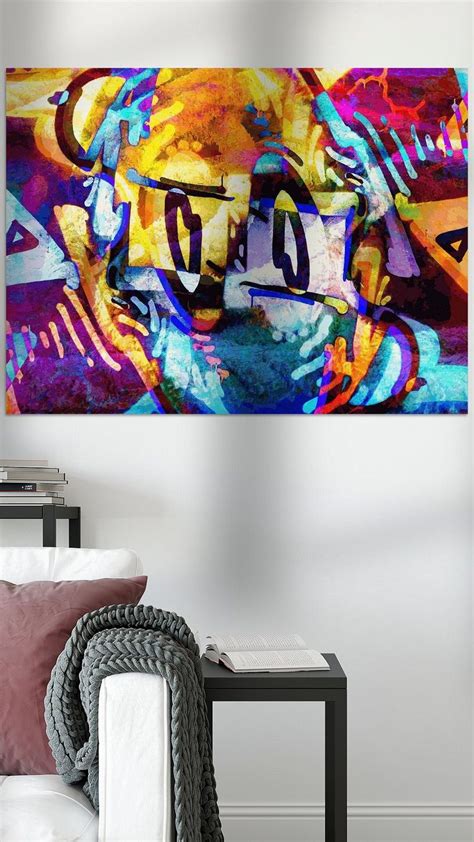 An Abstract Painting On The Wall Above A Couch