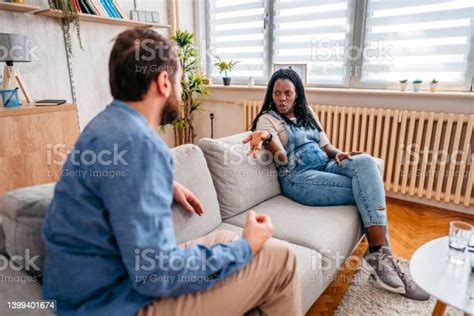 Young Mixed Race Couple Arguing At Home Stock Photo Download Image