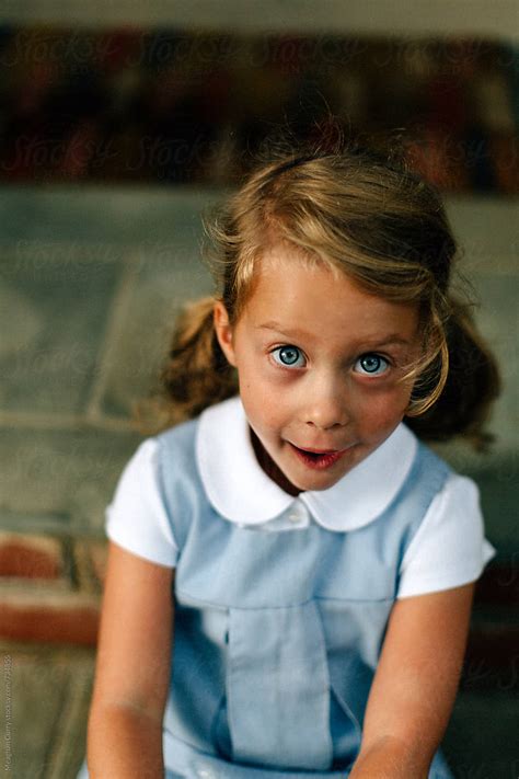 Little Girl In Uniform On Her First Day Of Kindergarten By Stocksy