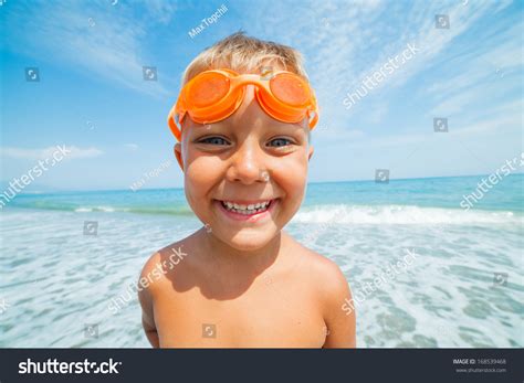 Playful Boy Swimming Goggles On Beach Stock Photo 168539468 Shutterstock