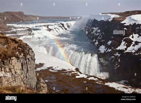 Gullfoss Waterfalls With Rainbow In Mist Above The Canyon Of Hvítá