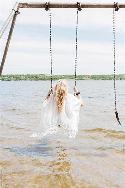 Woman Playing On Swing Set By Stocksy Contributor Carey Shaw Stocksy