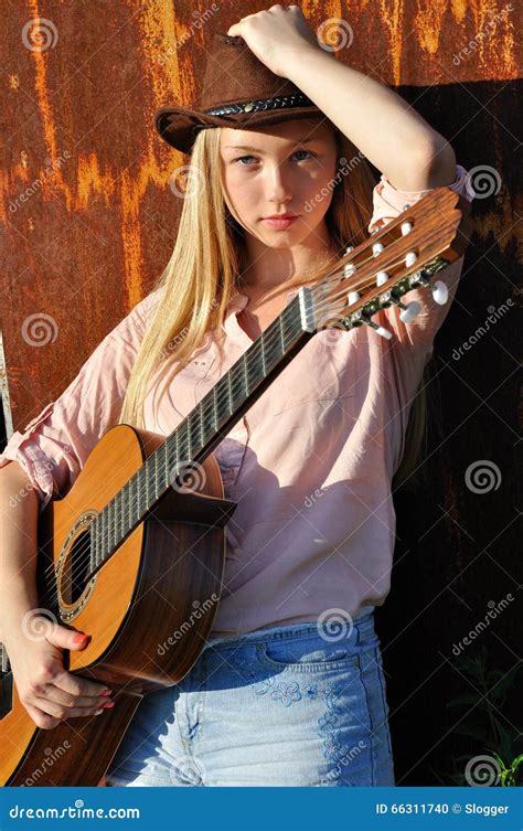 Teenage Girl Holding Guitar Stock Photo Image Of Serious Musician