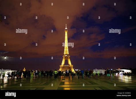 The Eiffel Tower Illuminated At Night Stock Photo Alamy