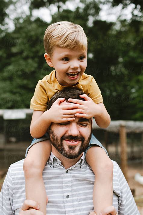 Little Boy On His Dads Shoulders By Stocksy Contributor Erin Drago
