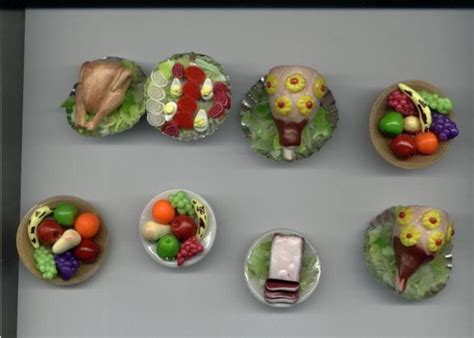 There Are Many Small Plates That Have Food On Them In The Shape Of
