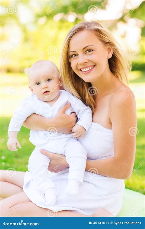 Happy Mother With Little Baby Sitting On Blanket Stock Image Image Of