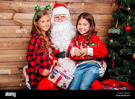 Santa Claus With Kids Indoors Christmas Celebration Concept Stock Photo