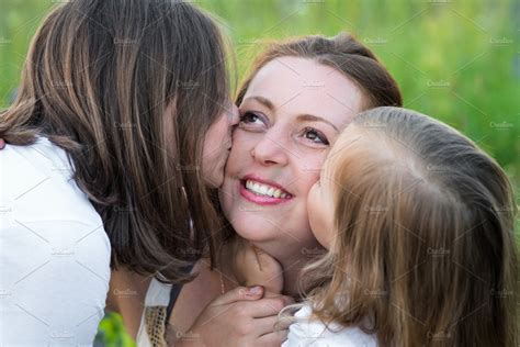 Two Daughters Kiss Mom People Images Creative Market