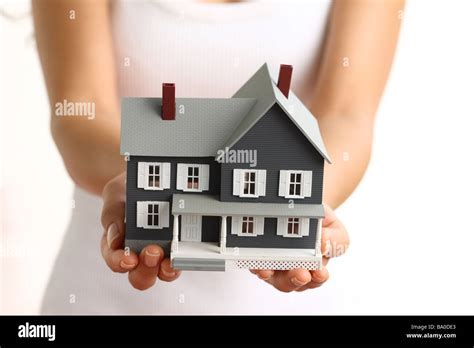 Hands Holding Small House Stock Photo Alamy