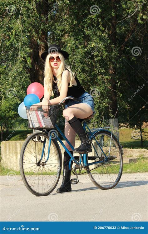 Young Attractive Blonde Girl Rides A Bike Stock Image Image Of