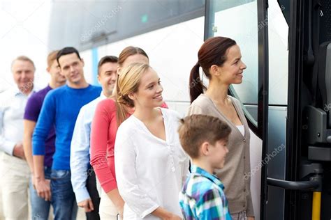 Group Of Happy Passengers Boarding Travel Bus Stock Photo By ©syda